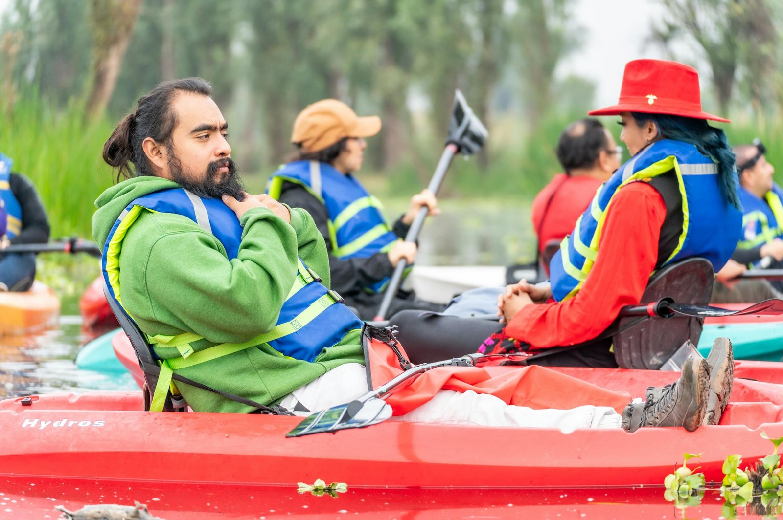 A group of people in kayaks on a river